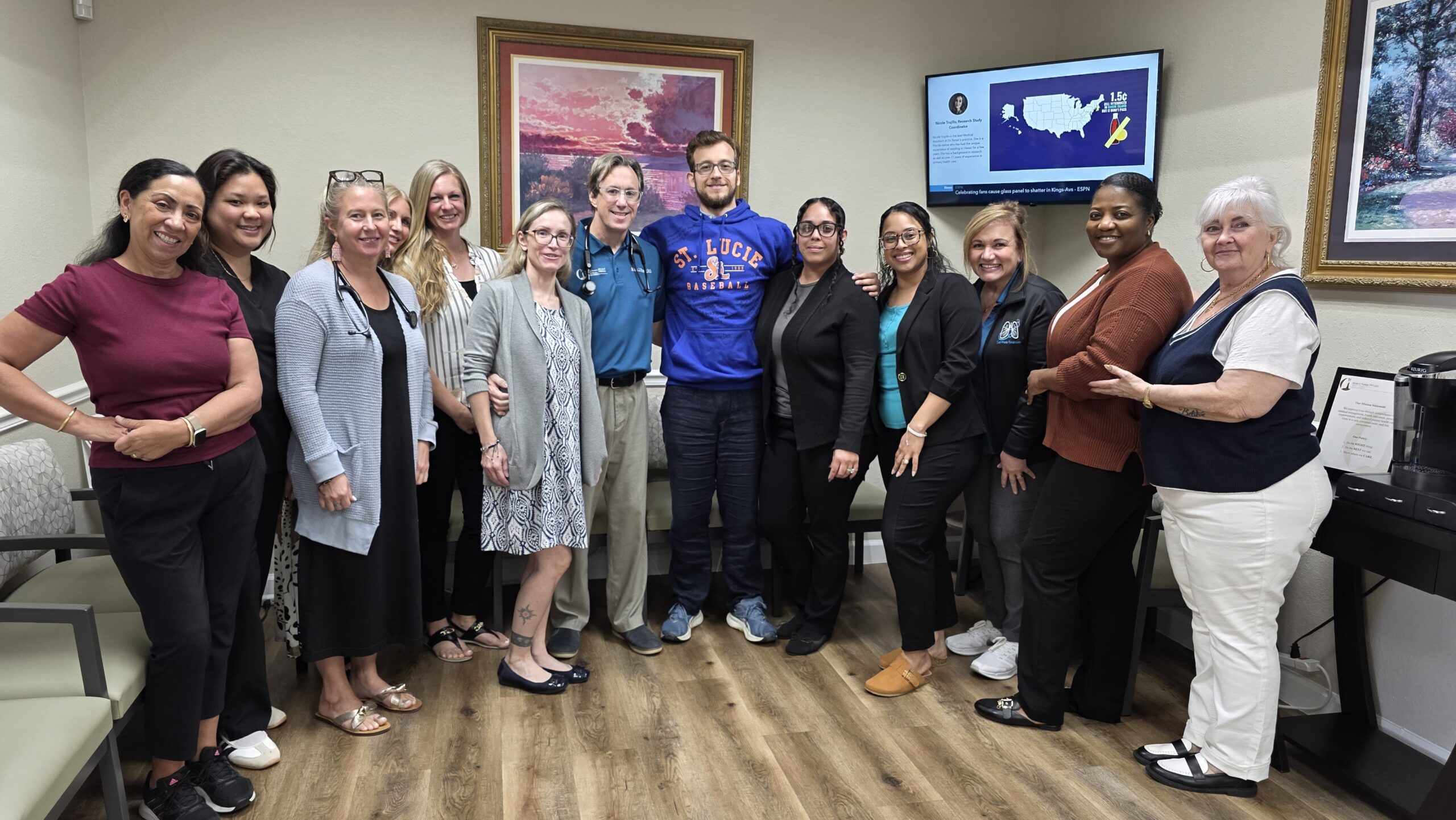 Group of diverse adults smiling together indoors.